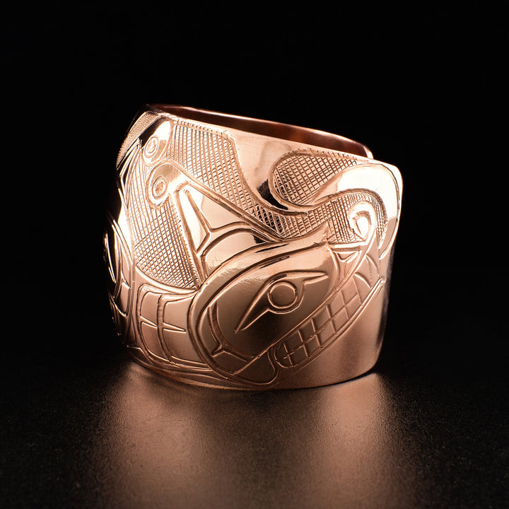 Photo of the left side of the bracelet shows carved design of the other Sisiutl head.