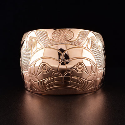 Cuff bracelet hand-carved by Kwakwaka'wakw artist Norman Seaweed. Bracelet depicts the two-headed sea serpent Sisiutl. 6.81" long with 1.38" gap and has width of 2". Ends taper down to 1.25".