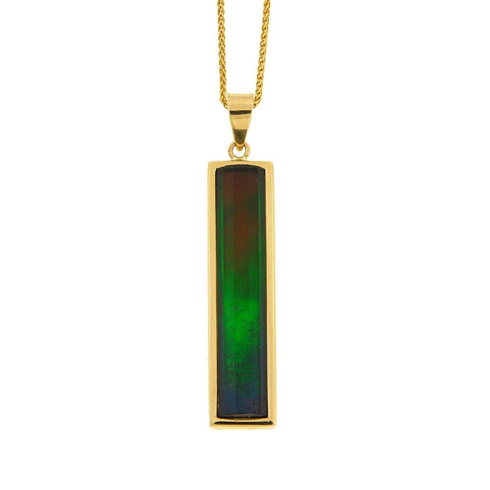 This ammolite pendant is made from 14K gold and grade (A) ammolite gemstone. The pendant is long, thin and rectangular with a large ammolite gem faceted into the piece.