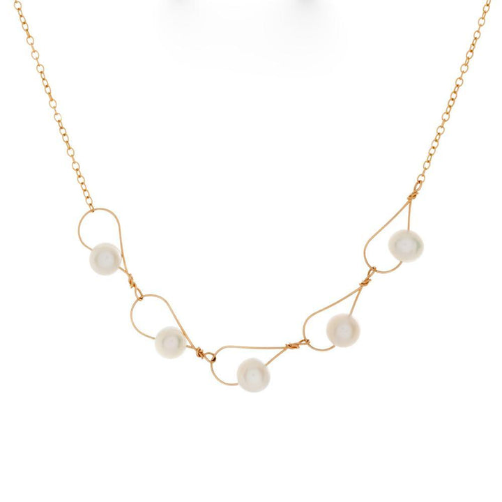 This filled gold chain necklace with pearls has been made by combining tear drop shaped links made from white freshwater pearls strung through gold fill wire. These links are connected to form this pearl, chain link necklace.
